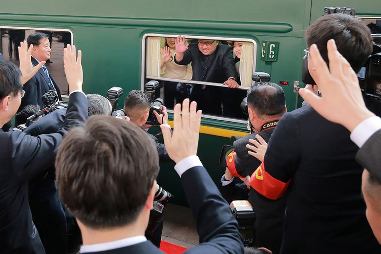This picture from North Korea's official Korean Central News Agency (KCNA) taken on March 27, 2018 and released on March 28, 2018 shows North Korean leader Kim Jong Un (C) waving from his train as it prepares to depart from Beijing railway station.
North Korean leader Kim Jong Un was treated to a lavish welcome by Chinese President Xi Jinping during a secretive trip to Beijing as both sides seek to repair frayed ties ahead of landmark summits with Seoul and Washington. / AFP PHOTO / KCNA VIA KNS / - / South Korea OUT / REPUBLIC OF KOREA OUT ---EDITORS NOTE--- RESTRICTED TO EDITORIAL USE - MANDATORY CREDIT 'AFP PHOTO/KCNA VIA KNS' - NO MARKETING NO ADVERTISING CAMPAIGNS - DISTRIBUTED AS A SERVICE TO CLIENTS
THIS PICTURE WAS MADE AVAILABLE BY A THIRD PARTY. AFP CAN NOT INDEPENDENTLY VERIFY THE AUTHENTICITY, LOCATION, DATE AND CONTENT OF THIS IMAGE. THIS PHOTO IS DISTRIBUTED EXACTLY AS RECEIVED BY AFP. / (Photo credit should read -/AFP/Getty Images)